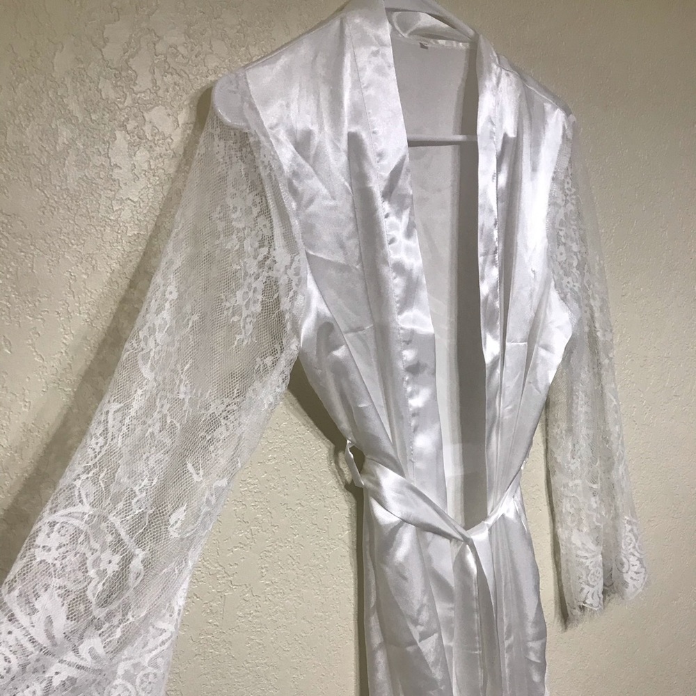 Lace sleeved white silk robe.